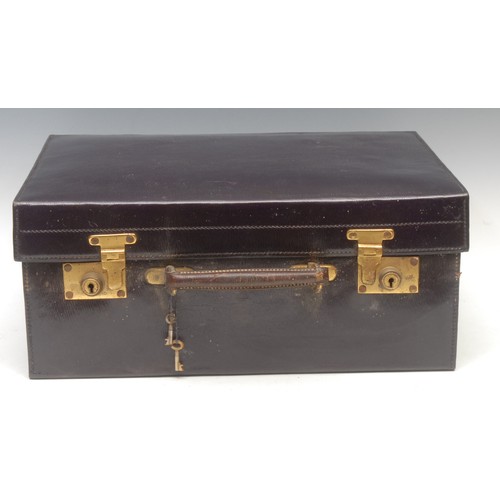 2201 - A George V silver fitted purple morocco leather travelling case, hinged cover enclosing bottles, jar... 