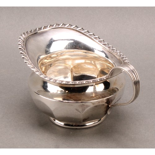1030 - An Edwardian silver cream jug, gadrooned border, 13cm long, James Dixon & Son Sheffield 1909, 162g