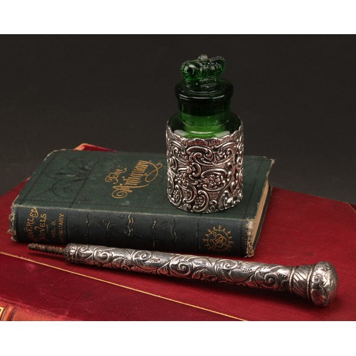 846 - A late Victorian silver clad green glass scent or salts bottle, crown stopper, the sleeve 10.5cm hig... 