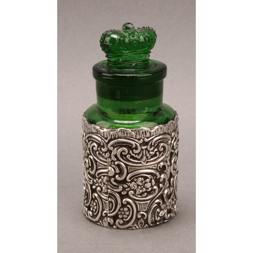 846 - A late Victorian silver clad green glass scent or salts bottle, crown stopper, the sleeve 10.5cm hig... 