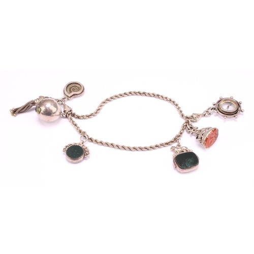 1238 - A Victorian silver bracelet suspending an oval carnelian seal stamp, with two doves beneath Vivons u... 