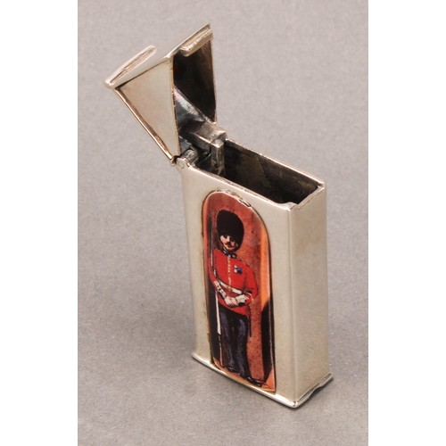 915 - A silver and enamel novelty vesta case, decorated with a guardsman in a sentry box, 6cm long, marked... 