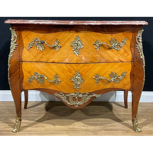 2409 - A Louis XV Revival gilt metal mounted satinwood and kingwood serpentine commode, marble top above tw... 