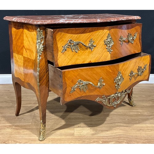 2409 - A Louis XV Revival gilt metal mounted satinwood and kingwood serpentine commode, marble top above tw... 