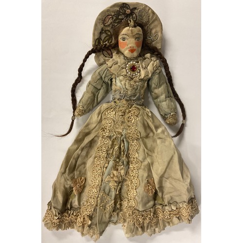 6409 - A 17th/18th century painted cloth doll as Queen Anne or high society Lady, wearing a halo headdress,... 