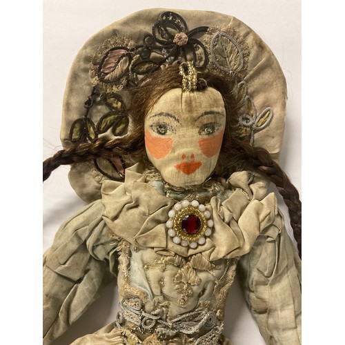 6409 - A 17th/18th century painted cloth doll as Queen Anne or high society Lady, wearing a halo headdress,... 