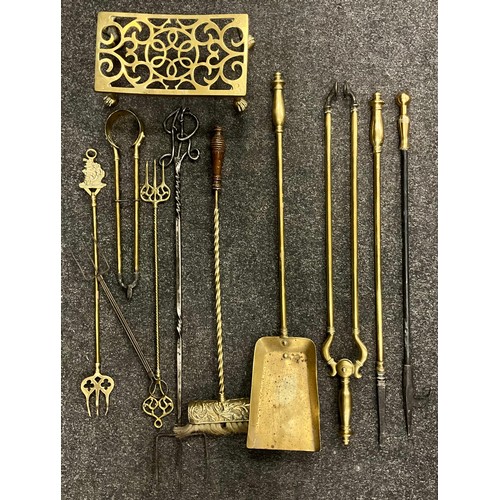 250 - Brass and Metalware - a set of three late 19th century brass fire irons, c.1900; a brass trivet; an ... 