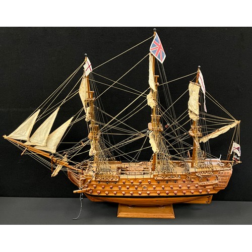 607A - A model wooden three mast tall ship, 62.5cm high x 77cm long.