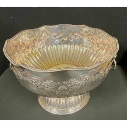 68 - A large silver plated pedestal punch bowl, embossed with foliate scrolls, lion mask loop handles, 33... 