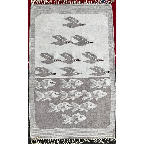 36 - A Navajo Yei wool rug, 127cm x 73cm;  a Moroccan kilim style rug, hand-knotted in rich red with trad... 