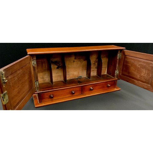 47 - An Edwardian mahogany desk top cabinet, oversailing top above a pair of doors enclosing stationery d... 