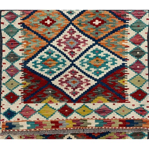 53 - A Turkish Anatolian Kilim runner carpet, 305cm x 80cm.