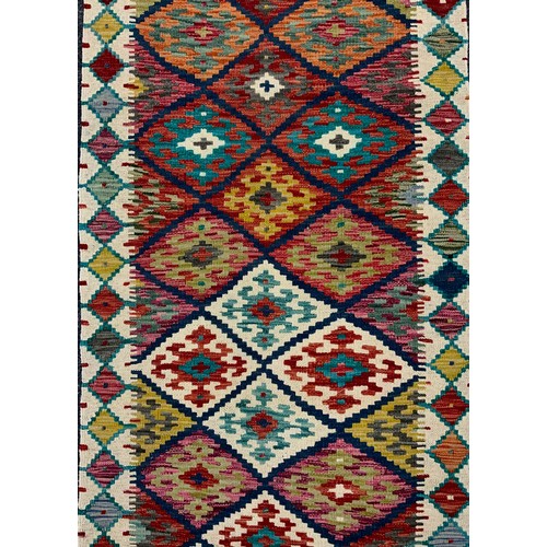 53 - A Turkish Anatolian Kilim runner carpet, 305cm x 80cm.