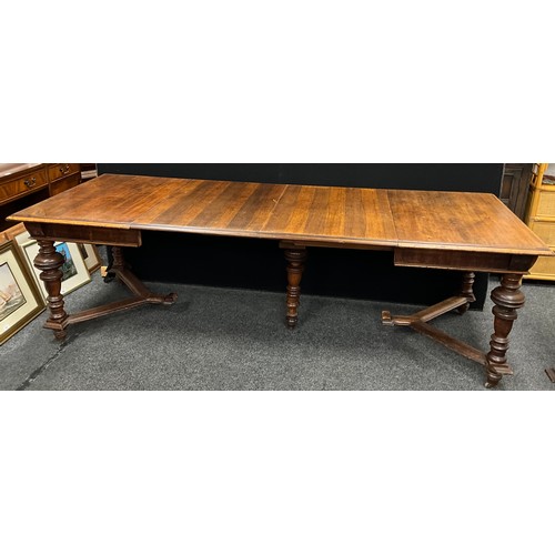 55 - A Victorian Arts and Crafts style pine and walnut extending dining table, the rectangular pine top w... 