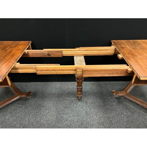 55 - A Victorian Arts and Crafts style pine and walnut extending dining table, the rectangular pine top w... 