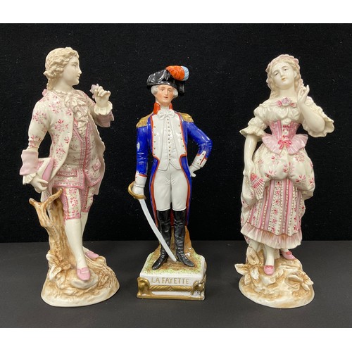 129 - A pair of 19th century continental porcelain figures, Dandy and companion, the man painted with pink... 