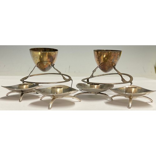 53 - A set of four Carl Cohr for Atla silver plated candle holders, modernist triangular bowls, tripod fe... 