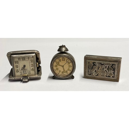 54 - An Art Deco silver cased travel watch, square dial with subsidiary seconds dial, engine turned cushi... 