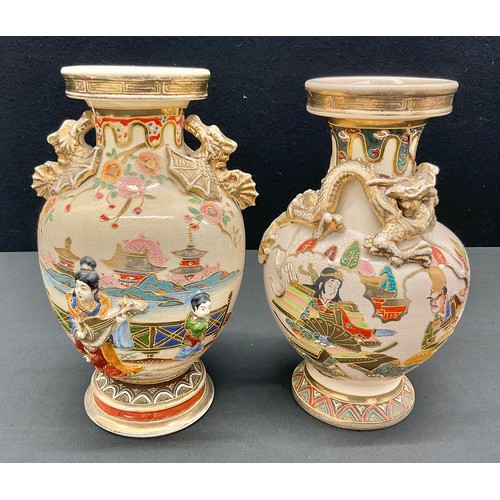 59 - A near pair of Japanese Satsuma pottery vases, relief decorated and painted with Dragons, Mythical B... 