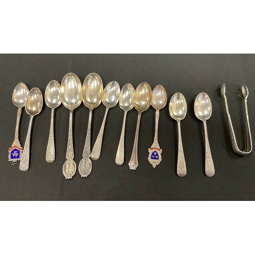 338 - An enamelled Manx Isle of man silver spoon, five Victorian silver tea spoons, others assorted sugar ... 