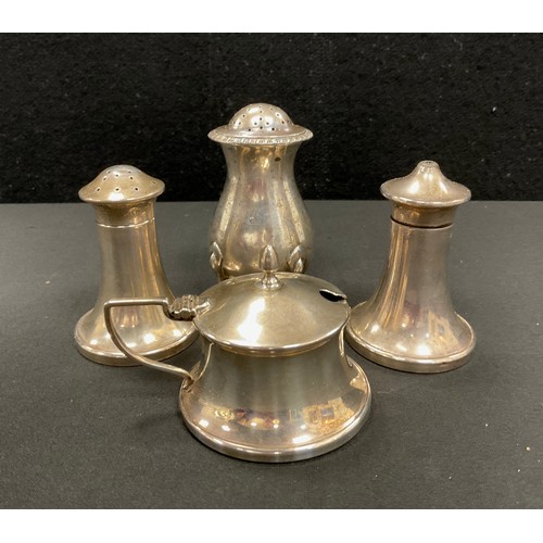 349 - A George V silver mounted three piece condiment set, salt, pepper and mustard, Birmingham 1934; anot... 