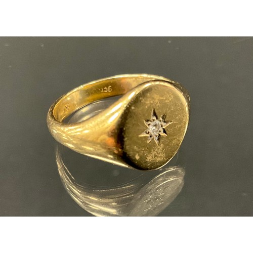 415 - A 9ct gold diamond accented signet ring, stamped 9ct, size Q, 6.2g gross