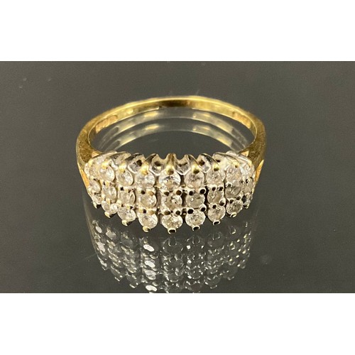 416 - A diamond cluster ring, set with three rows of round brilliant cut diamonds, total diamond weight 0.... 