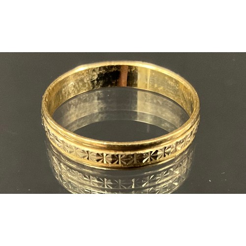 417 - A yellow metal textured wedding band ring, stamped 750 A, CORSO, 2.7g