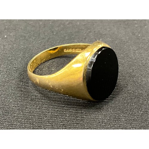 419 - A 9ct gold black onyx signet ring, size Q, 3.9g gross