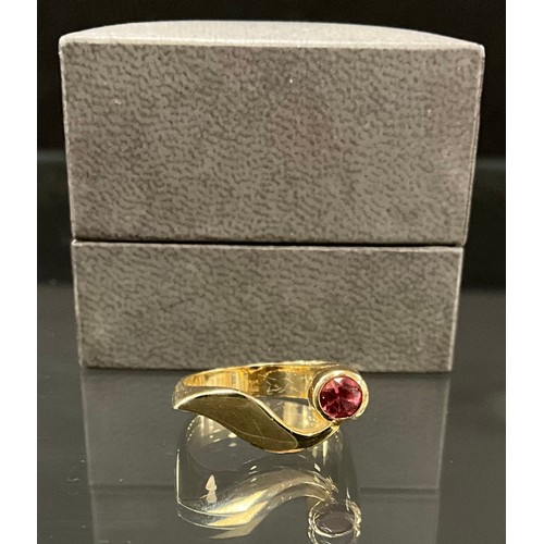 420 - A south African pink tourmaline dress ring, unusual shaped serpentine shank, set with a single pink ... 