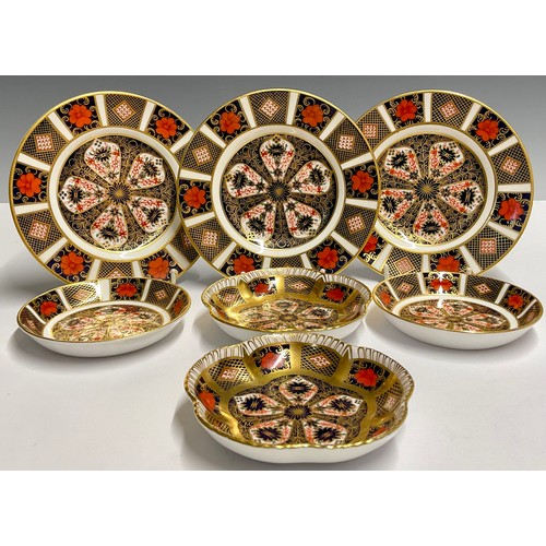 18 - A pair of Royal Crown Derby Imari 1128 pattern five petal trays, 11.5cm, seconds; a pair of 1128 cir... 