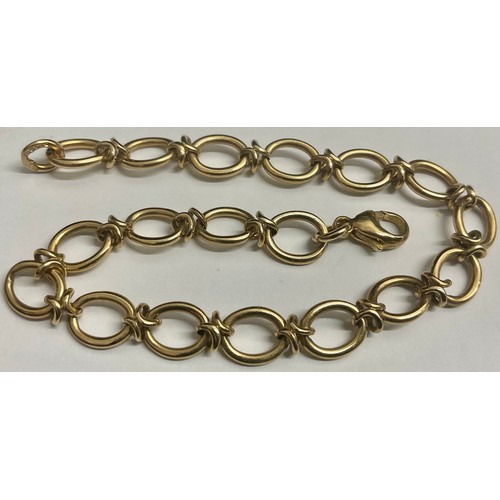 643 - A 9ct gold fancy link bracelet, 20cm long, 9.6g