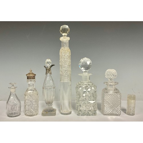 649 - Five 19th century cut glass scent flasks; a Georgian silver muonted bottle; a silver topped pepper (... 