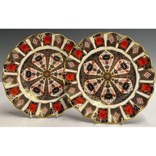 32 - Royal Crown Derby - a pair of 1128 Imari wavy rim plates, 21cm diameter, printed marks (2)