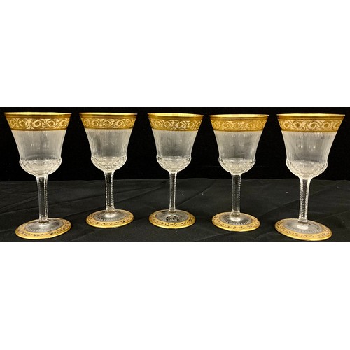 6 - A set of five Saint Louis crystal wine glasses, fluted shape with gilt detail, 16cm high, (5).