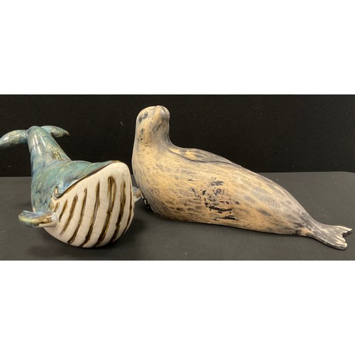 18 - Studio pottery blue glazed humpback whale, 30cm long; carved wood sealion, 30cm long, (2).