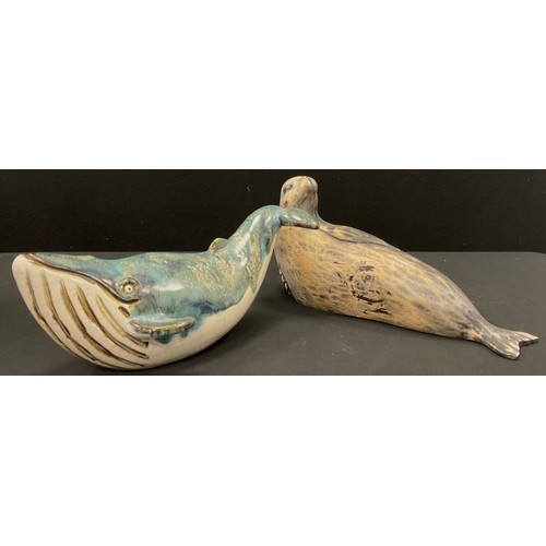 18 - Studio pottery blue glazed humpback whale, 30cm long; carved wood sealion, 30cm long, (2).