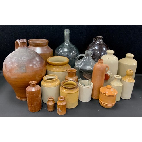 20 - Stoneware including; An 19th century salt glazed stoneware flagon of bulbous shape, with a moulded s... 