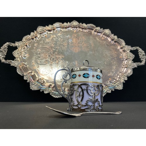 44 - A silver mounted Chocolate pot, scrolling cradle, cover and spoon, Sheffield 1917;  oval silver plat... 