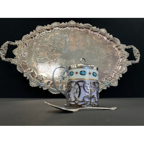 44 - A silver mounted Chocolate pot, scrolling cradle, cover and spoon, Sheffield 1917;  oval silver plat... 