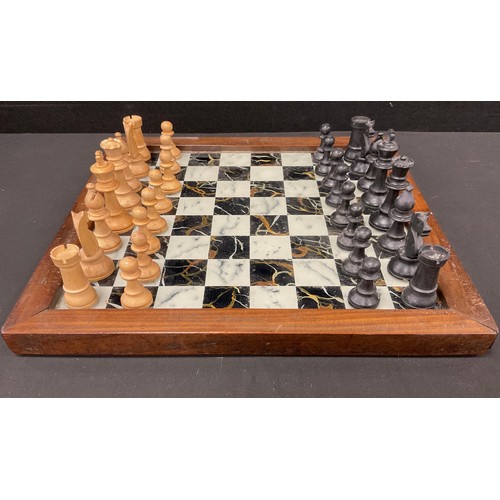 48 - A Staunton pattern box wood and ebony chess set, height of king, 7.8cm high, with wooden framed glas... 