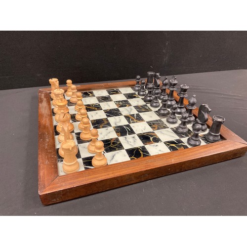 48 - A Staunton pattern box wood and ebony chess set, height of king, 7.8cm high, with wooden framed glas... 