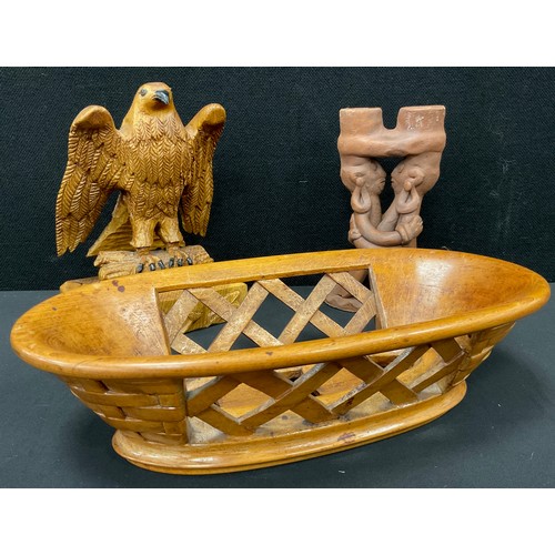 49 - A Pitcairn Island style carved wooden bowl, basket-weave decoration, 30cm wide;  a carved oak eagle,... 