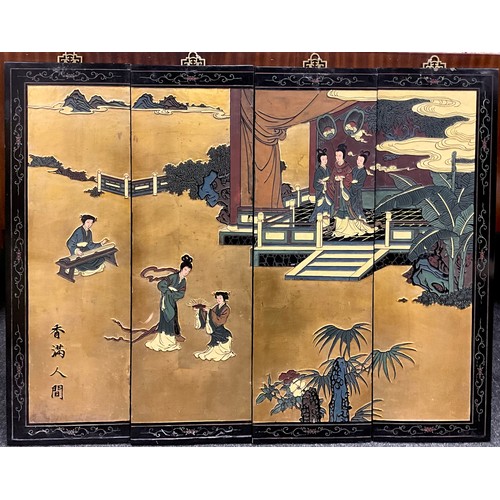 50A - A Japanese Showa period lacquer work and gilt, carved wood four-panel wall decoration, depicting a s... 