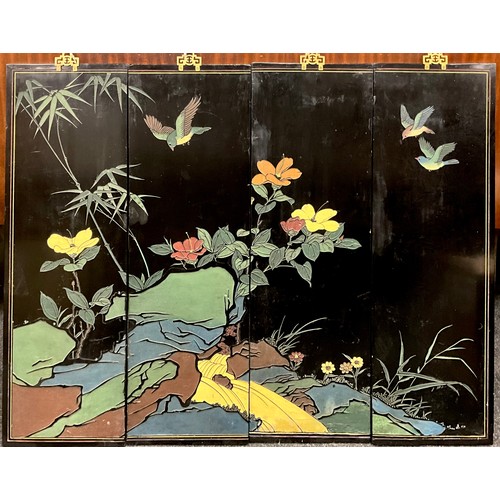 50A - A Japanese Showa period lacquer work and gilt, carved wood four-panel wall decoration, depicting a s... 