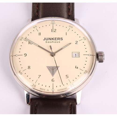 1031 - Junkers - a Bauhaus 6046-5 wristwatch, 39mm stainless steel case, cream dial, Arabic numerals, date ... 