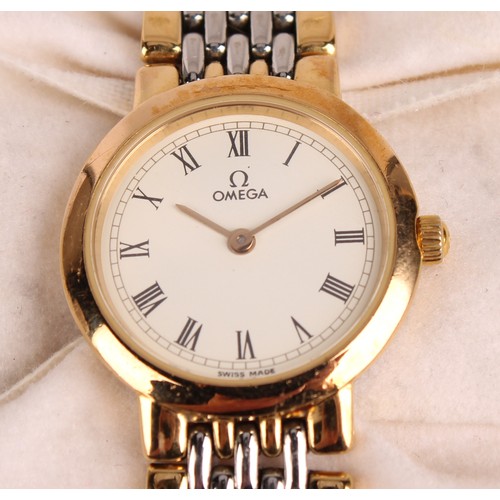 1042 - Omega  - a lady's Deville two tone gold and steel bracelet watch, white dial, Roman numerals, quartz... 