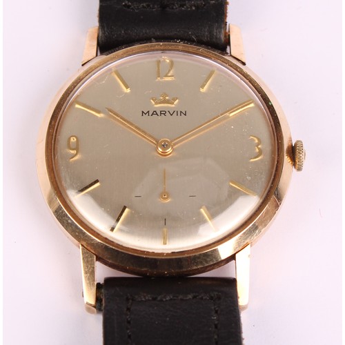 1093 - A Marvin 9ct gold cased wristwatch, silvered dial, quartered Arabic numerals and block baton markers... 