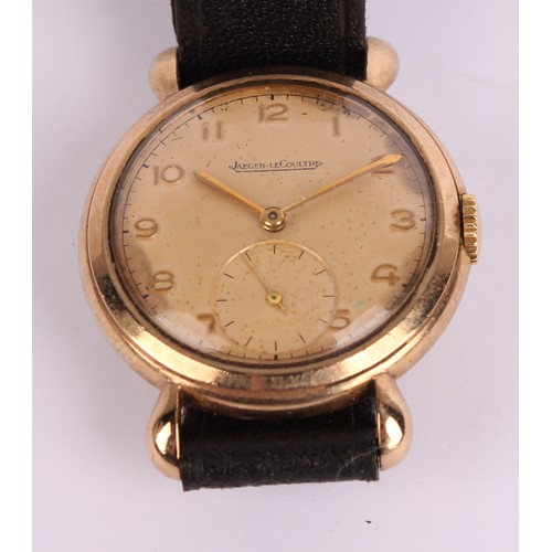 1109 - Jaeger Le Coultre - a 1950s 9ct gold cased wristwatch, salmon dial, raised Arabic numerals, subsidia... 