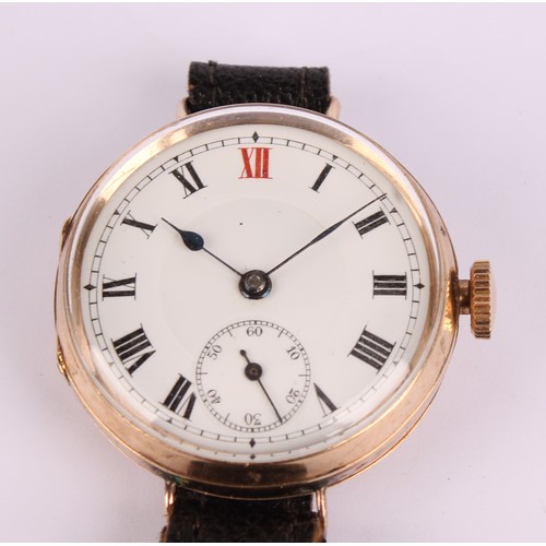 1117 - A 9ct gold trench wristwatch, 31mm diameter case, white enamel dial, black Roman numerals with red 1... 